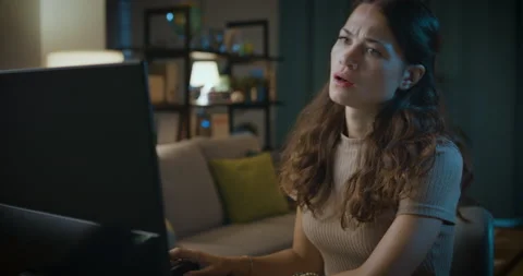 Disappointed woman having problems with her computer Stock Footage 162995852