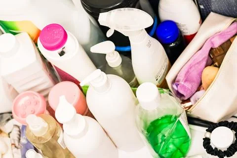 Disarray of hygiene supplies in bathroom bin Stock Photos