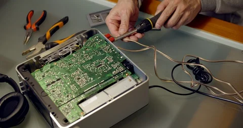 Disassembeling and repairing damaged musical player Stock Footage 128319763