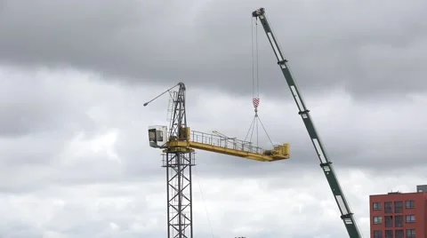 Disassemble crane on cloudy sky background. 4K Stock Footage 52230297