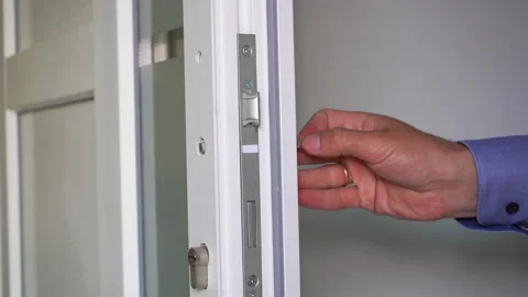 Disassemble the lock in the plastic door Stock Footage 237313189