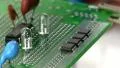 Disassemble surface mount IC from circuit by hand Video HD