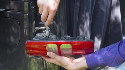 Disassemble the taillight of a car Stock-Footage 311039422