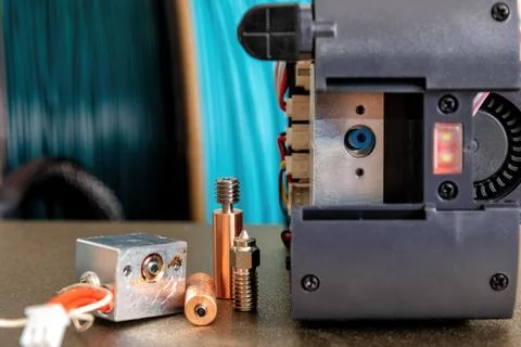Disassembled 3d printer head and broken heat block and nozzle Stock Photos