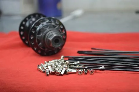 Disassembled bicycle bushing with spokes close up Stock Photos