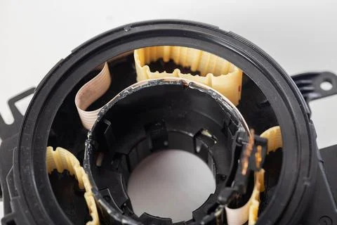 Disassembled broken steering column electrical cable on white background Stock Photos