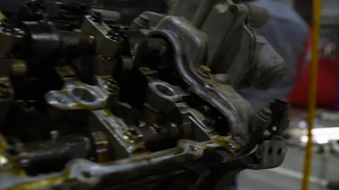 The disassembled car engine. Footage. Old auto engine in service in repair. 動画素材 128829989