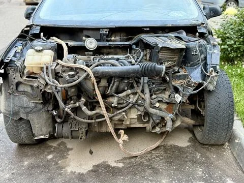 Disassembled Car Engine Showcasing Its Exposed Components Awaiting Repairs and Stock Photos