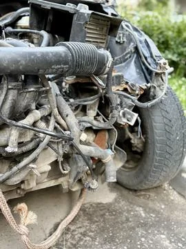 Disassembled Car Engine Showcasing Its Exposed Components Awaiting Repairs and 写真素材
