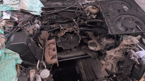 Disassembled car engine undergoing repair in a garage Stock Footage 304120221