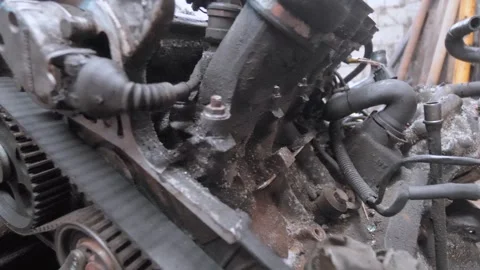 Disassembled car engine undergoing repair in a garage Stock Footage 304120285