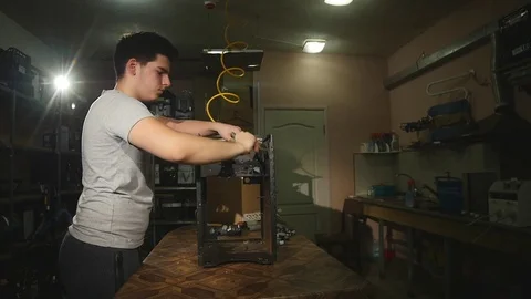 Disassembled coffee machine, Guy cleans the surface of coffee dust with a brush Stock Footage 78561715