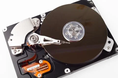 Disassembled computer hard drive with mirror disks on a white background Foto stock