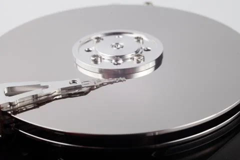 Disassembled computer hard drive with mirror disks on a white background Foto stock