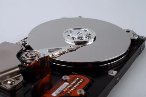 Disassembled computer hard drive with mirror disks on a white background, sof Stock Photos