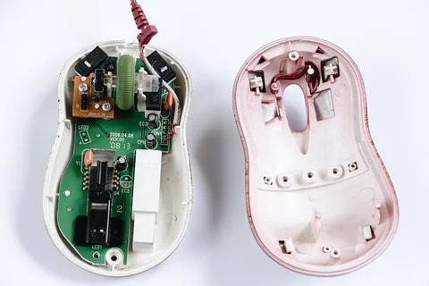 Disassembled computer mouse on white background. Gadget repair. Foto stock