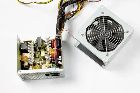 Disassembled computer power supply on white background Stock Photos