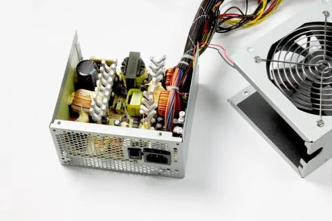 Disassembled computer power supply on white background Foto stock