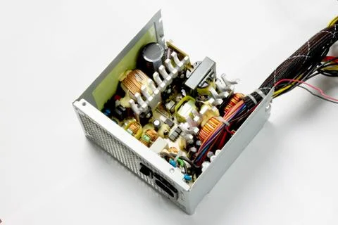 Disassembled computer power supply on white background Foto stock
