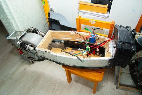 Disassembled electric scooter pulled out battery Stock Photos