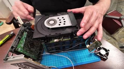 Disassembled electronic device with exposed circuit boards and components Stock Footage 305654762