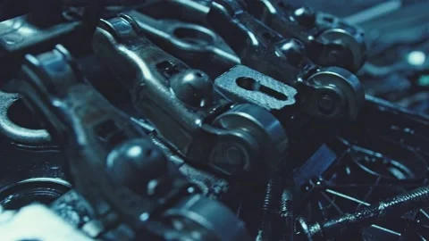 Disassembled engine in auto repair. Old piston with yellow motor oil and rings Stock Footage 155619183