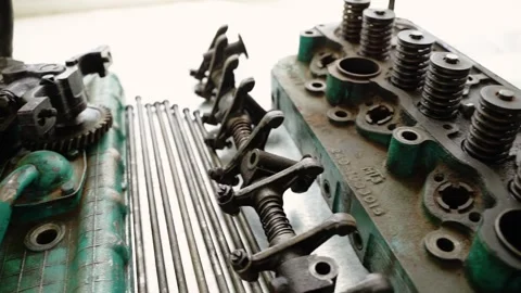Disassembled engine cylinder head with valve springs on workbench Video stock 348029567