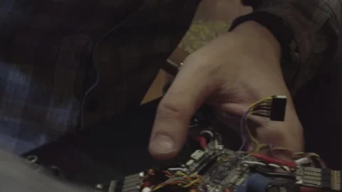 Disassembled FPV quadrocopter, do-it-yourself drone repair on a black table Stock Footage 168280268