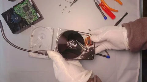 Disassembled hard drive from the computer, hdd with mirror effect. Opened har 스톡 동영상 112349235