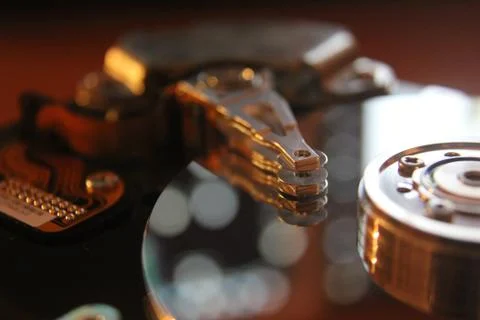 Disassembled hard drive from the computer, hdd with mirror effect. Opened hard Stock Photos