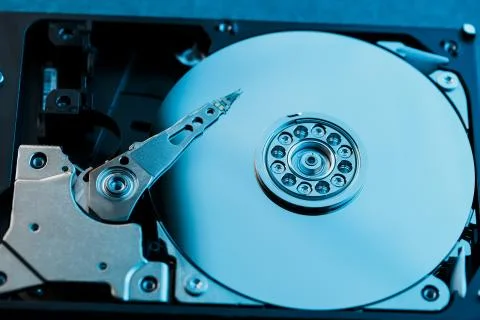 Disassembled hard drive from the computer, hdd with mirror effect. Opened har Stock Photos