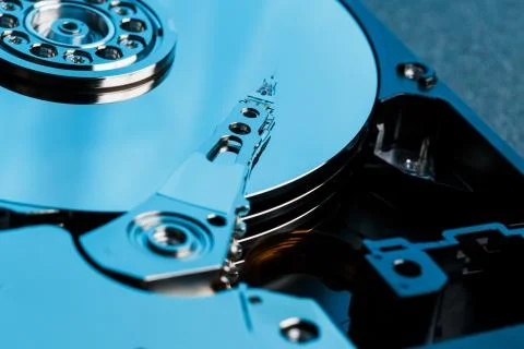 Disassembled hard drive from the computer, hdd with mirror effect. Opened har 스톡 사진