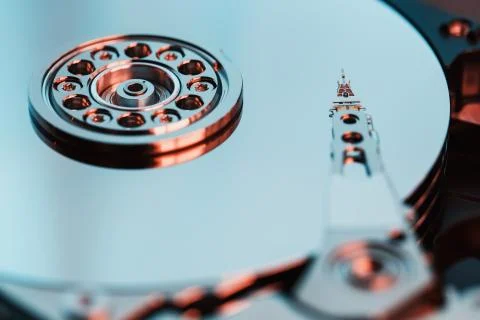 Disassembled hard drive from the computer, hdd with mirror effect. Opened har Stock Photos