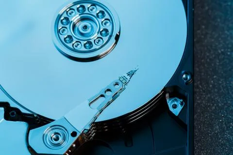 Disassembled hard drive from the computer, hdd with mirror effect. Opened har Stock Photos
