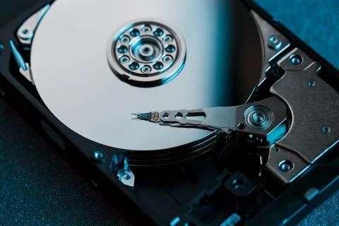 Disassembled hard drive from the computer, hdd with mirror effect. Opened har Stock Photos