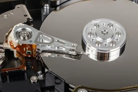 Disassembled hard drive from the computer, hdd with mirror effect. Opened h.. Stock Photos