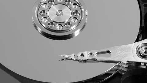 Disassembled hard drive from the computer, hdd with mirror effect. Opened har Stock Photos