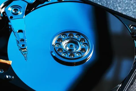 Disassembled hard drive from the computer, hdd with mirror effect. Opened h.. Stock Photos