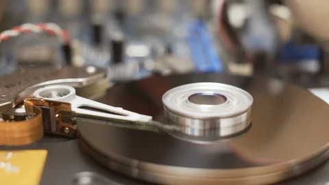 Disassembled hard drive working process seamless looping Stock Footage 88599365