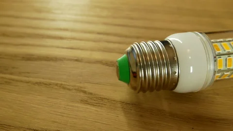 The disassembled LED corn lamp is on the table. Base E27 Stock-Footage 132314086