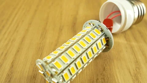 The disassembled LED corn lamp is on the table. Base E27 Stock-Footage 132314233
