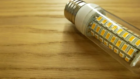 The disassembled LED corn lamp is on the table. Base E27 Stock-Footage 132314320