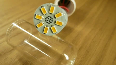 The disassembled LED corn lamp is on the table. Base E27 Stock-Footage 132314587