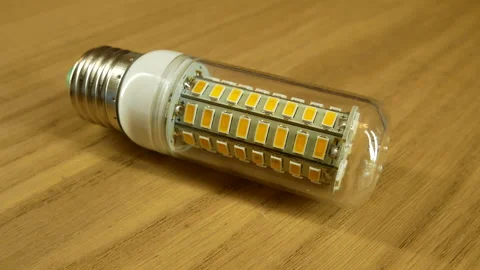 The disassembled LED corn lamp is on the table. Base E27 Stock-Footage 132314896