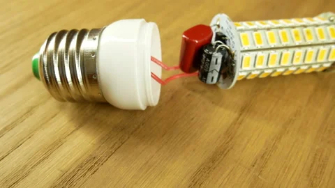 The disassembled LED corn lamp is on the table. Base E27 Stock-Footage 132314936