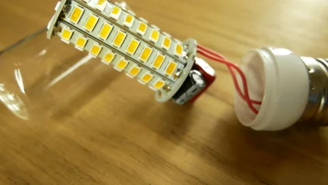 The disassembled LED corn lamp is on the table. Base E27 Stock-Footage 132314937