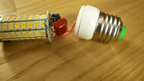 The disassembled LED corn lamp is on the table. Base E27 Stock-Footage 132314945
