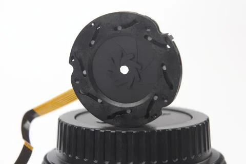 Disassembled part of the aperture of the camera lens Stock Photos