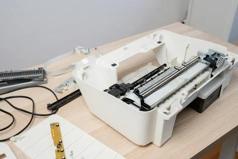 Disassembled Printer On Desk Being Repaired - Technician Working On Office .. Stock Photos