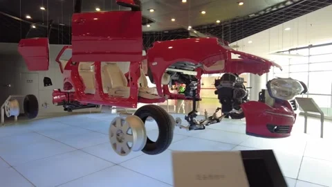 Disassembled red Volkswagen Polo exploded car suspended exhibit Stock-Footage 339264343